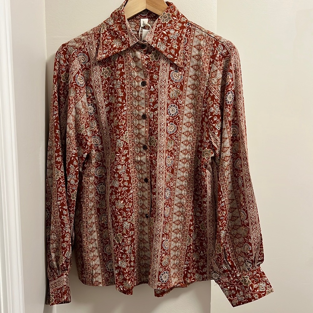 Beautiful design button down with ruched back for shape!